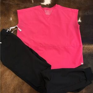 Figs Bright Pink Scrub Top and black jogger pants